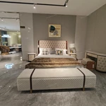 Diamond-Tufted Leather Bed with Curved High-Gloss Wood Side Borders